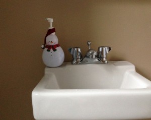 snowman soap dispenser adds Christmas cheer to a bathroom